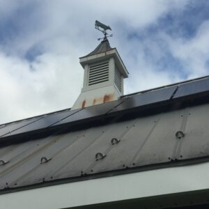 photo Old Technology and New - Taken at the Comfort Station on September 17, 2017,of the mix of the weather vane, snow guards and solar panels by Courtney Heflin