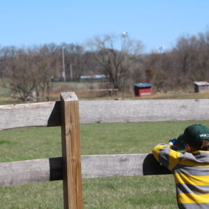 photo Budding Photographer - We walked around the back of the barns and my grandson, was intently taking pictures.  Taken on March 31, 2018 by Mirjam Spaar