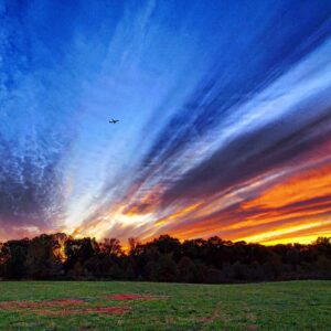 photo Final Approach - Taken as a plane nears BWI airport through color-streaked skies in November 2022 by Adam Pegues
