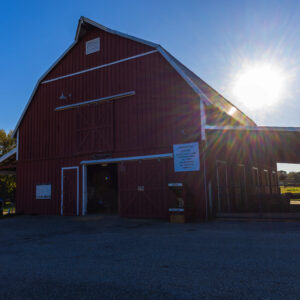 photo Above the Barn, a Plane Glides Through Open Skies - Taken on October 22, 2023 by Kurt DeLorenzo