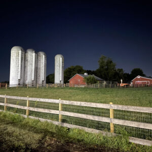 photo Silos - Taken before sunrise while on patrol of the silos and farm complex before dawn just prior to the Lifeline event on October 1, 2023.  The fields were illuminated by vehicle headlights. by Bradly Hunt