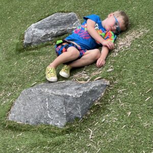 photo One Tired Boy - Taken on the hill of the playground on August 10, 2023 by Carol Leslie