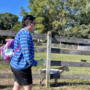 photo Excited for Goats - Submitted in loving memory of Wren. This photo was taken on October 11, 2024, it shows Wren's excitement when first arriving at the goat area. by Orion Romero & Wren Spates