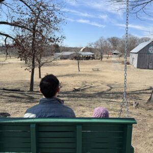 photo Swing With Me, Daddy! - Taken on the wooden swing behind the Visitor's Center on February 25, 2025. by Kathleen Schaidle